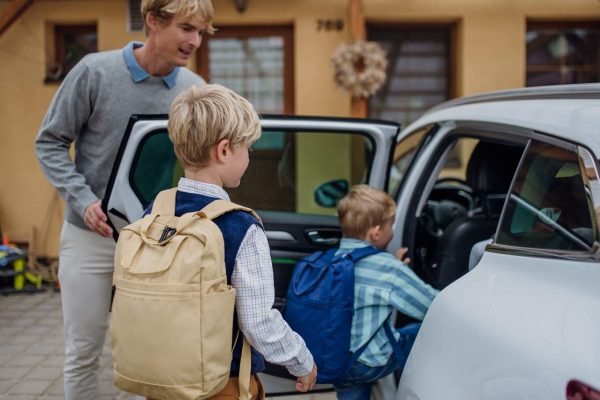 children-getting-into-the-car-father-taking-them-2024-10-18-08-45-36-utc